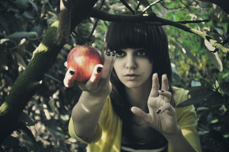 Woman taking apple of youth