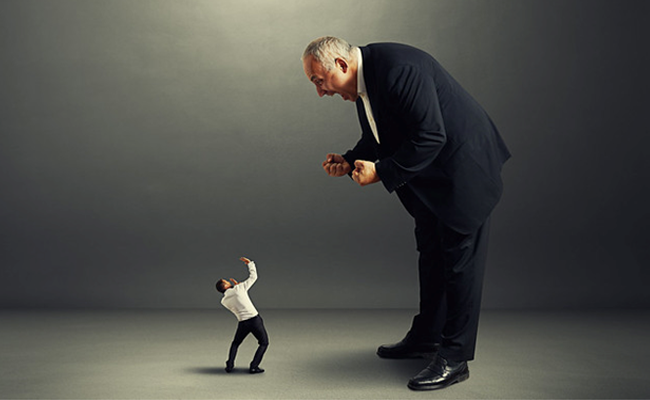 Man yelling at another man for failure in implementing decisions